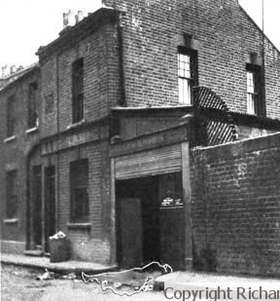 A black and white image showing the site of the murder of Mary Nichols.