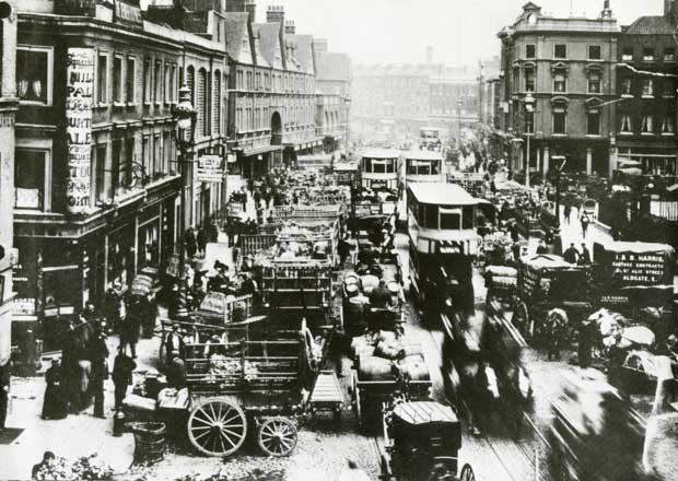 An image of Commercial Street filled with horse-drawn carts and carriages.