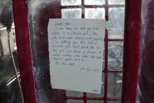 A yellow mpost it note with a message to Holmes.