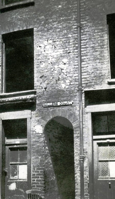 A view of the arched entrance to Miller's Court.