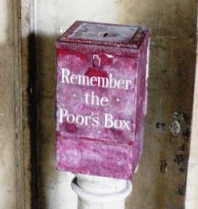 The red box with Remember the Poor's box written on it.
