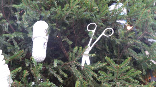 A pair of scissors and a white pill decorations.
