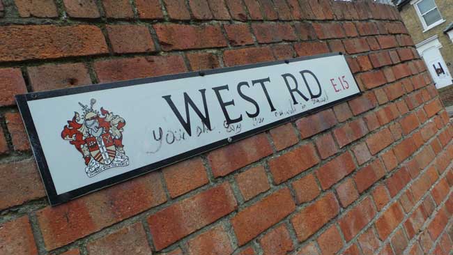 The sign saying West Road.
