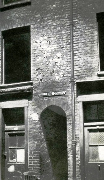 A view of the arched entrance into Miller's Court.
