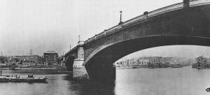 A view of the stone arches of Southwark Bridge.