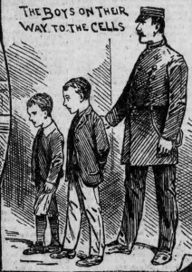 A Jailer leads the Coombes brothers to the cells.