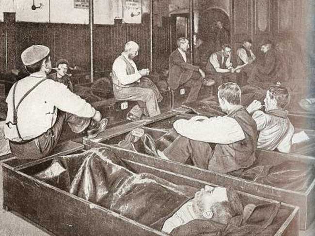 Men sleep in Coffin Beds.
