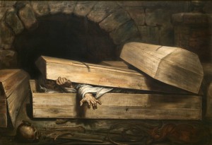 A prson tries to get out from a coffin