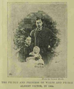 The Pirnce and Princess of Wales holding the infant Prince Albert Victor.