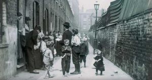 A look into an slum alley of Victorian London.