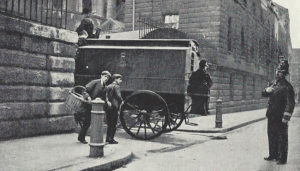 A city policeman watching a prisoner arrive for trial at the Old Bailey Court.