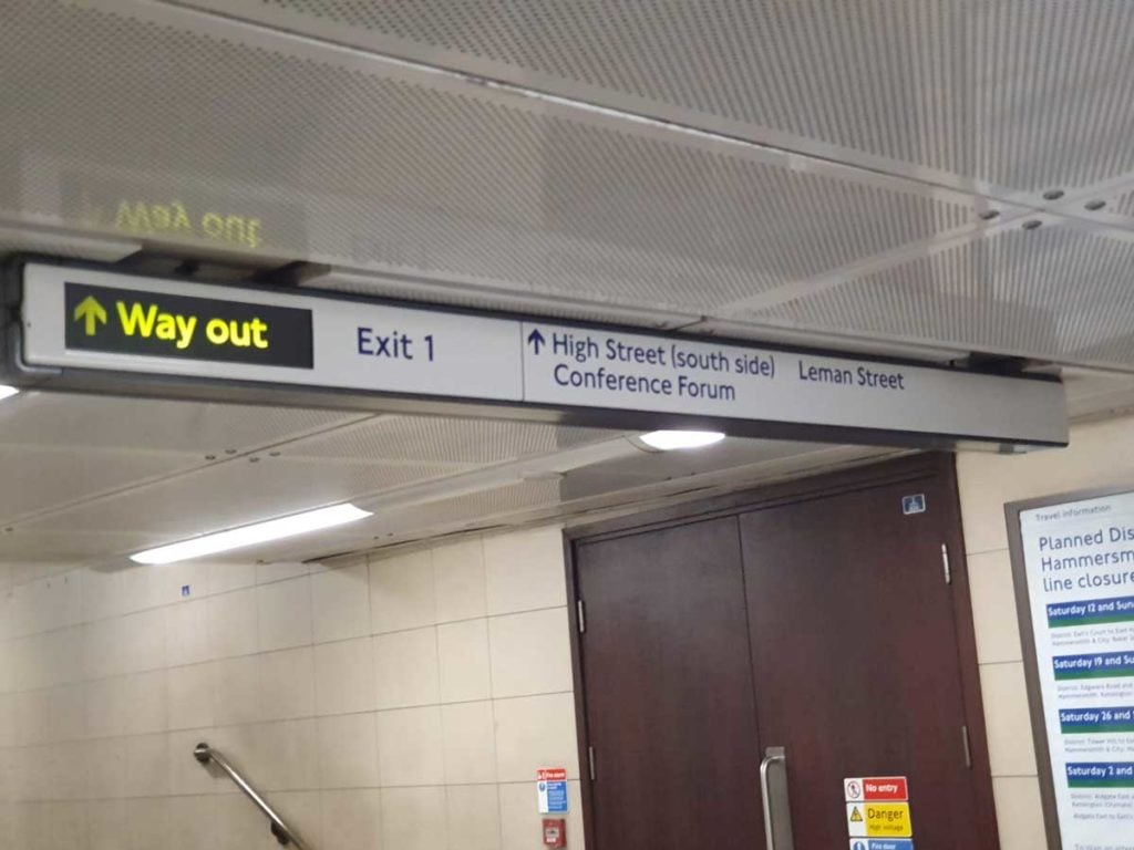 The sign for exit one inside the station.