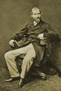 A photograph of Henry Vizetelly showing him seated in a chair.