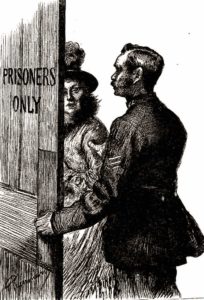 A policeman ushers a female prisoner into the court.